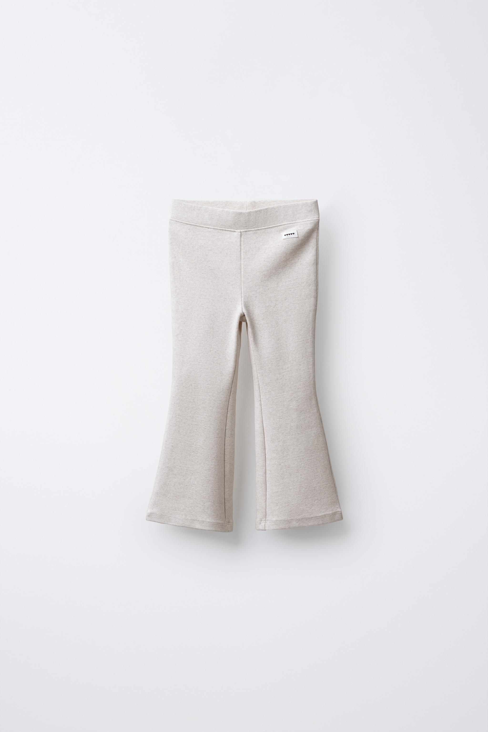 INTERLOCK FLARE LEGGINGS WITH LABEL DETAIL